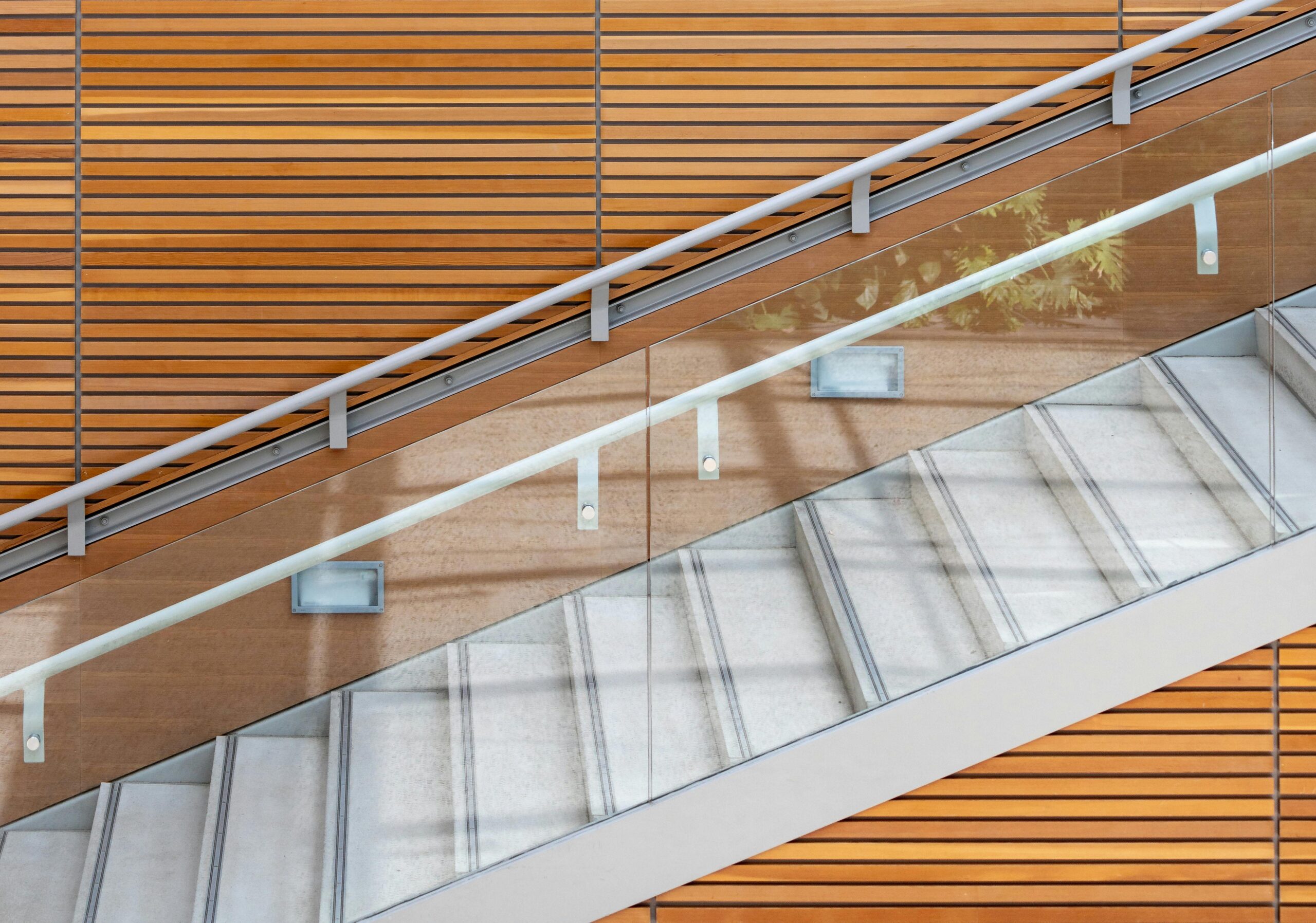 Minimalist Architecture & Invisible Supports: The Role of Slimline Handrail Brackets