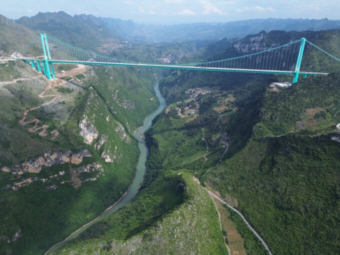World’s Highest Bridge Opens in China With a Spectacular Waterfall Curtain