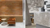 Diptych of Basics Coffee: an orange armchair against the ribbed terracotta wall, and a close-up of the speckled granite counter edge with stacked cups