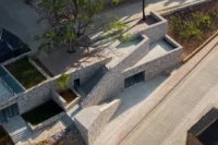 Aerial view of the terraced platforms of Bawan Village Visitor Center by TAO