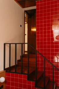 Red tiled stair at Celine and Lolo Hotel by Powerhouse Company