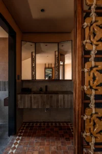 Bathroom behind a patterned screen at Da Homestay by 3fconcept