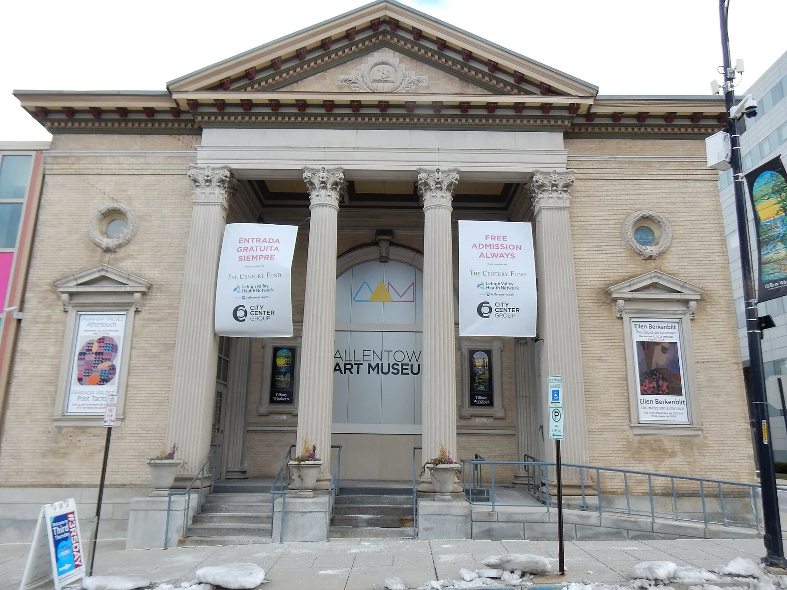 Neoclassical columned portico of the Allentown Art Museum with exhibition banners