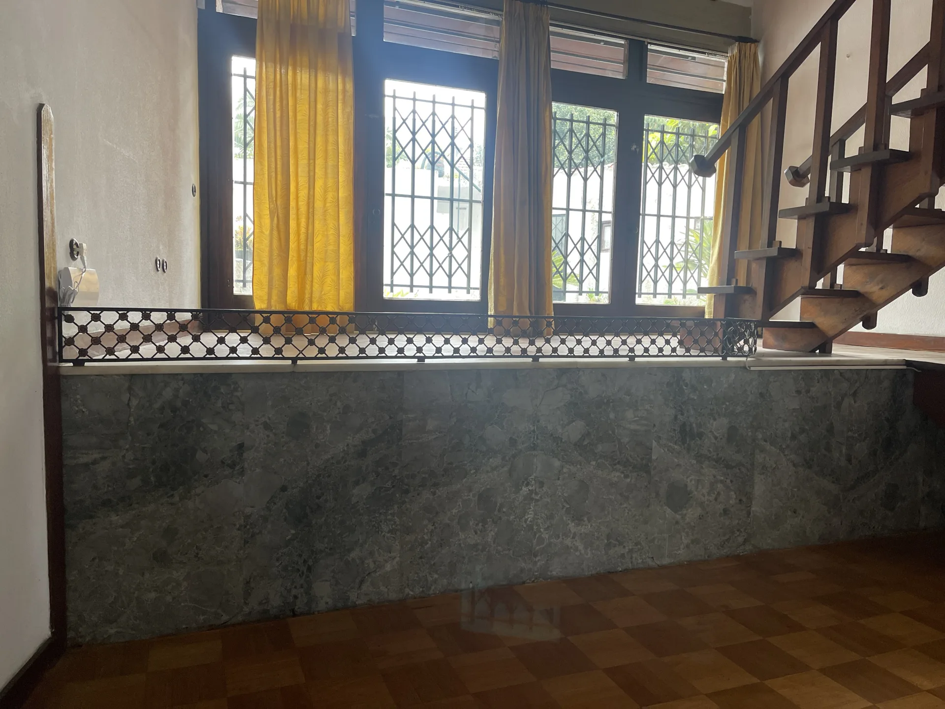 Living room before the reactivation, with the area beside the staircase unrestored, Casa d’Abreu Neto by Álvaro Siza