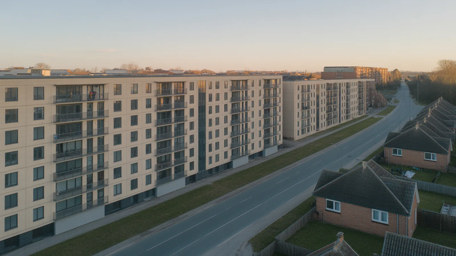 Aerial view of a density edge where mid-rise apartments end and low-rise houses begin