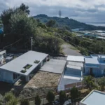 Overlapping Concrete Walls and One Roof Shape a House in Okinawa