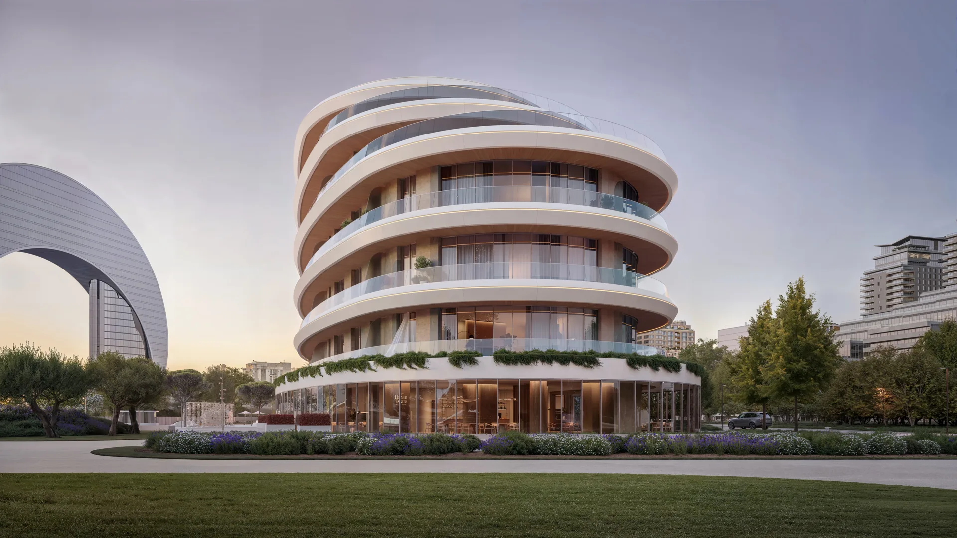 Rounded corner building with deep horizontal terraces and planted ledges, seen across a lawn