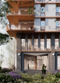 Base of a housing tower with brick piers, glazed ground floor cafe and curved copper balconies above planting