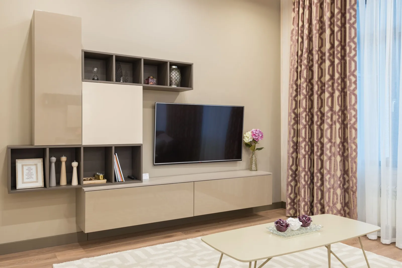 Modular media wall mixing open display cubes with closed glossy cabinet fronts