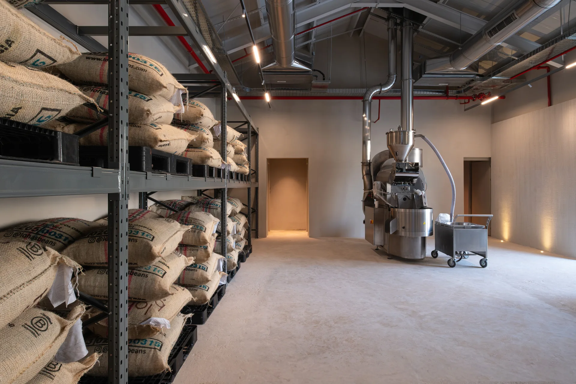 The open roastery with its industrial roasting machine, Origin Cafe and Roasters Jax