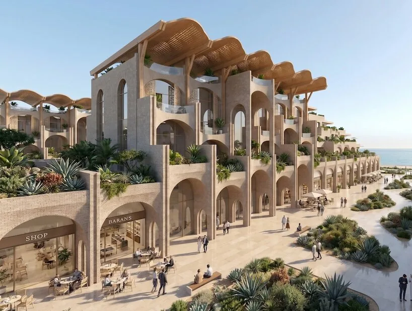 Arched multi-story building with rooftop pergolas, shops and terraces overlooking the sea