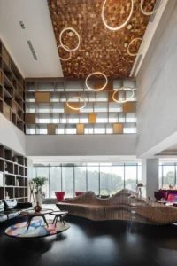 Curved seating under the patterned ceiling at New City Medical Plaza