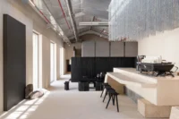 The long hall and monolithic counter at Origin Cafe and Roasters Jax by S.DA