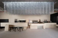 The serving counter beneath the suspended metal chains, Origin Cafe and Roasters Jax