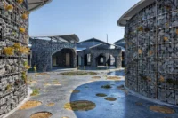 Gabion drums and ponds in the courtyard of Future Life Village Pavilion