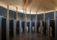 Cubicles under the CLT roof of the toilet building, Future Life Village Pavilion