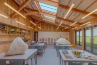 Work tables in the learning studio at Sheep Field Barn by DSDHA