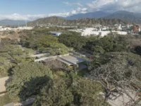 Student Center Santa Marta by El Equipo Mazzanti seen from above among the trees