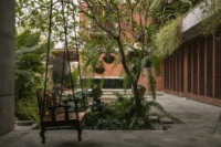 The frangipani beside the old well in the courtyard of The House of Memories