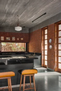 Kitchen and dining counter at The House of Memories by Studio Lagom
