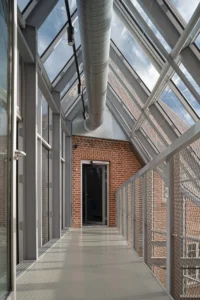 The greenhouse corridor between villa and tower, Tidsmaskinen After-School Center