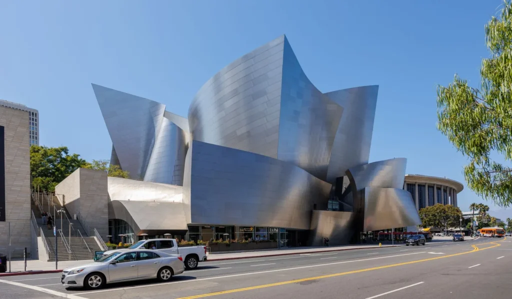 Stainless steel sails of the Walt Disney Concert Hall rising above Grand Avenue in Los Angeles