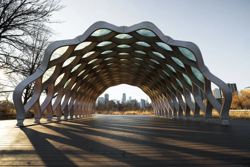 Arched pavilion built from curved panels and ribs, the kind of form modeled in Rhino and Grasshopper