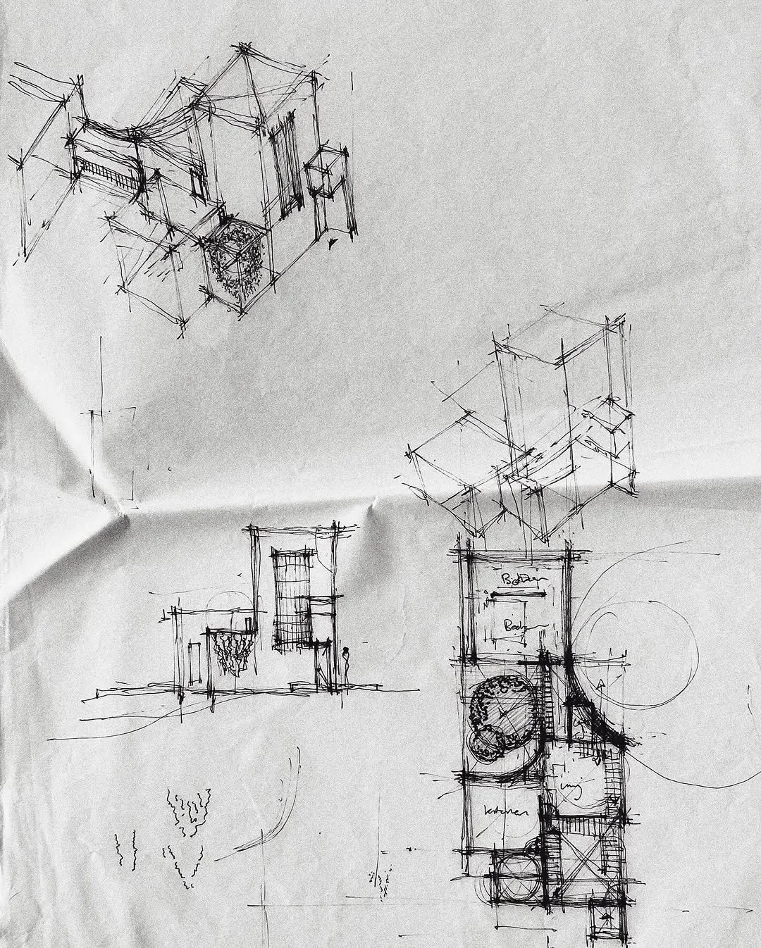 Early process sketches on crumpled tracing paper studying axonometric massing and plan grids for a farmhouse
