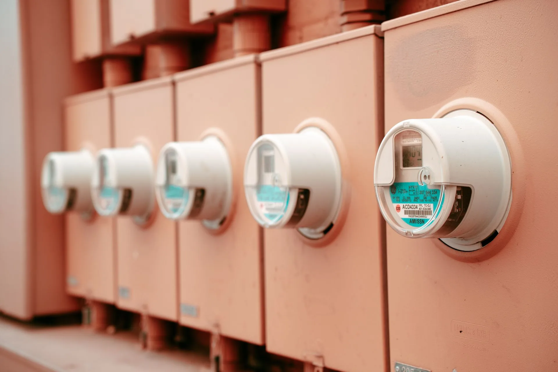 Row of electricity meters on the wall of a multi unit residential building