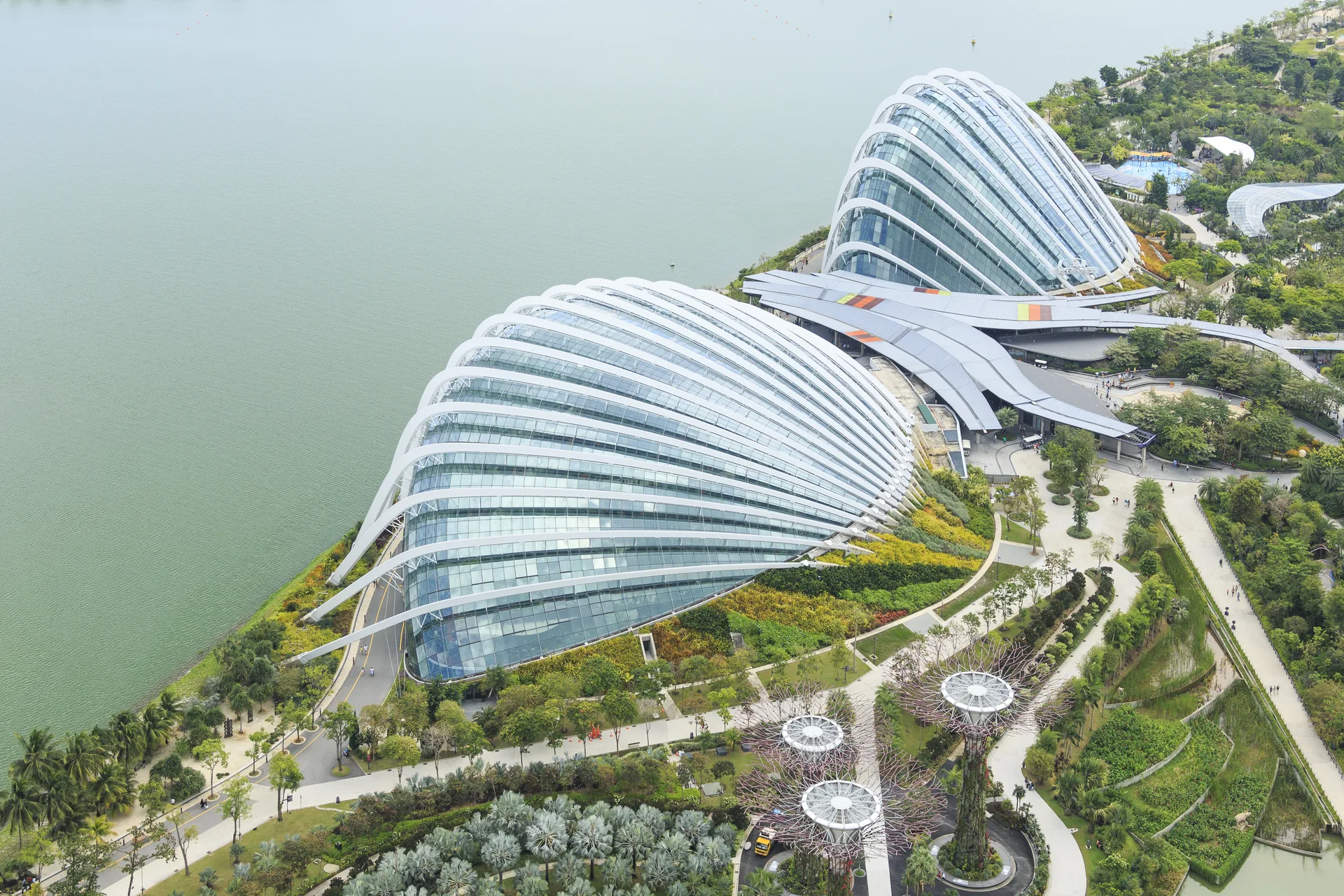Aerial view of the Flower Dome and Cloud Forest glass conservatories at Gardens by the Bay on the Singapore waterfront