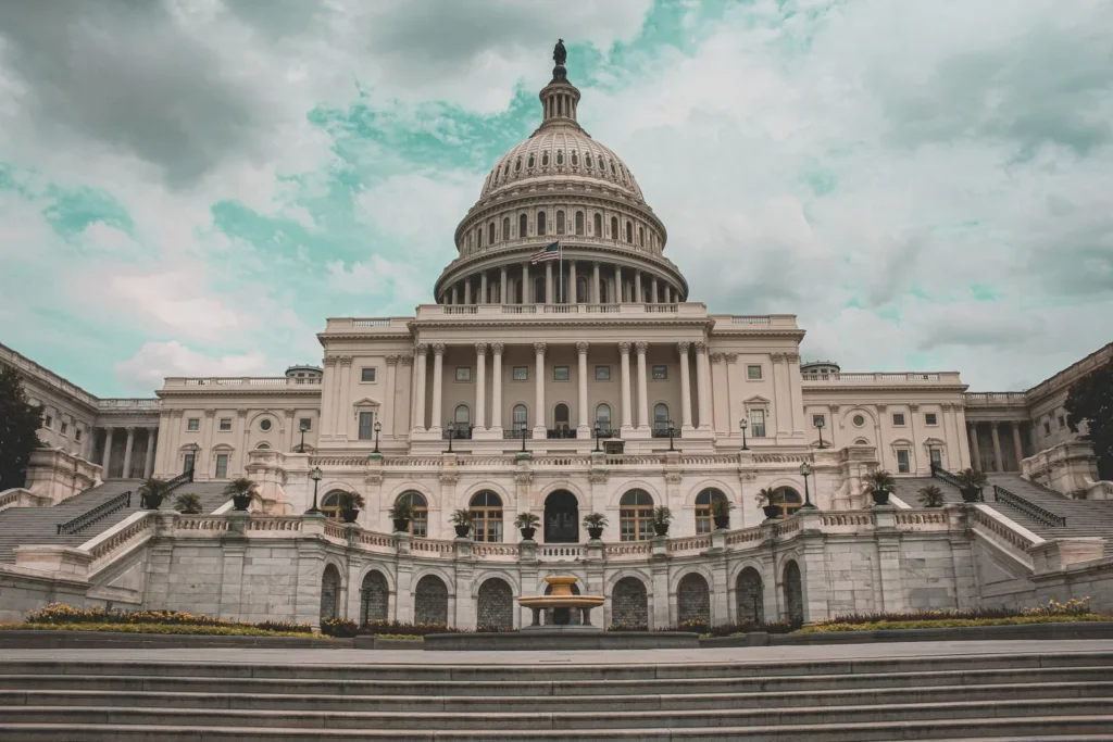 Front of the United States Capitol in Washington with its white dome and broad stone steps, a classic case of architecture and politics