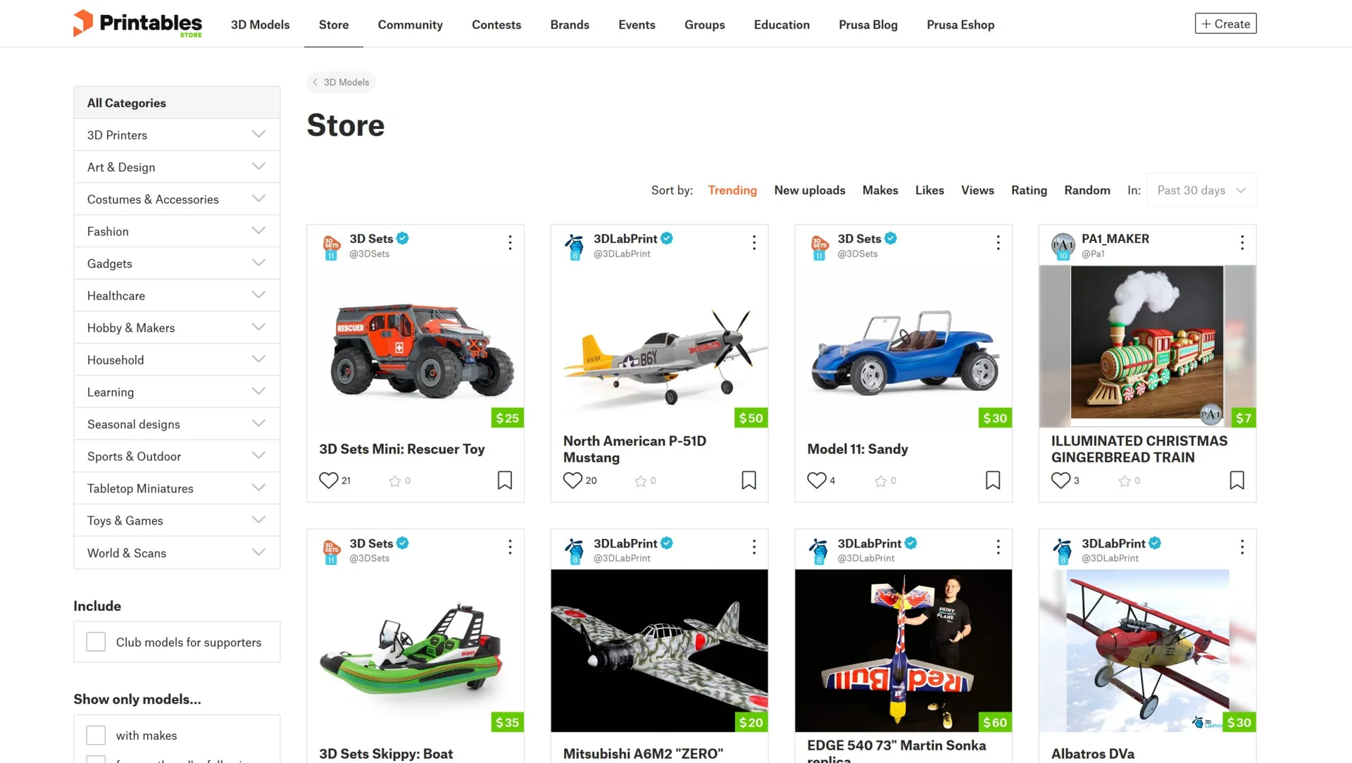 Printables Store page with a category sidebar and paid 3D print models of toy cars, planes and a gingerbread train
