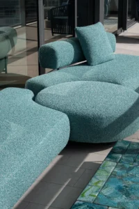 Turquoise textured outdoor sofa and a mosaic cocktail table on the terrace, PS Apartment by Nar Design Studio