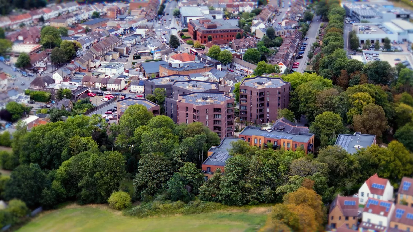 Aerial view of Coulsdon showing the brick blocks of Lion Green Road among trees and surrounding streets