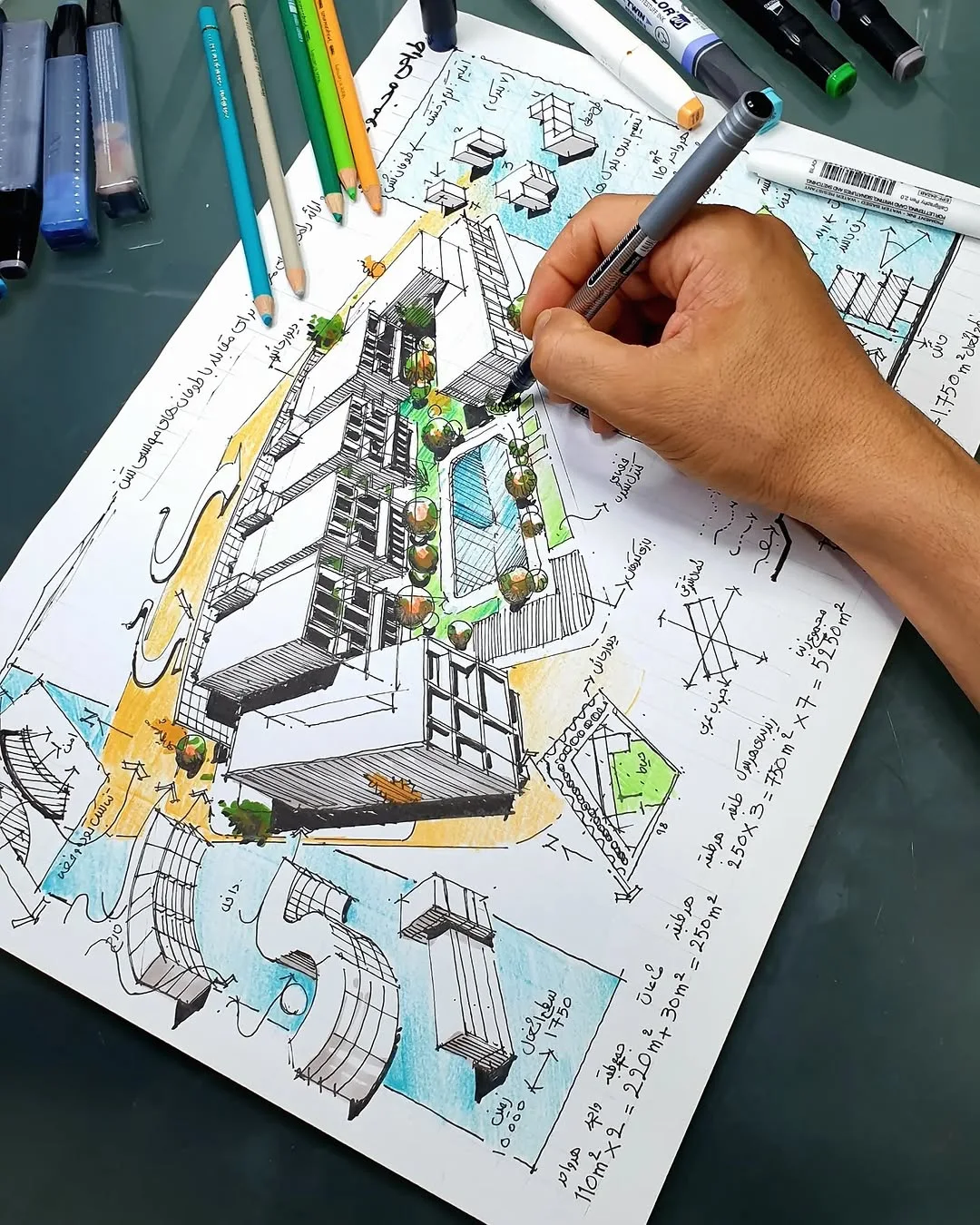 Hand drawing a colored pencil axonometric of a building with notes and plans around it